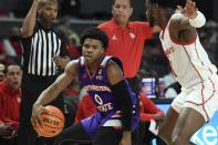 Northwestern State guard Brian White (0) is defended by Houston guard Jamal Shead during the first half of an NCAA college basketball game Tuesday, Nov. 30, 2021, in Houston. (AP Photo/Justin Rex)