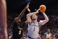 Kansas center Hunter Dickinson (1) attempts to score against Houston forward Ja'Vier Francis (5) during the first half of an NCAA college basketball game, Saturday, Feb. 3, 2024, in Lawrence, Kan. (AP Photo/Colin E. Braley)