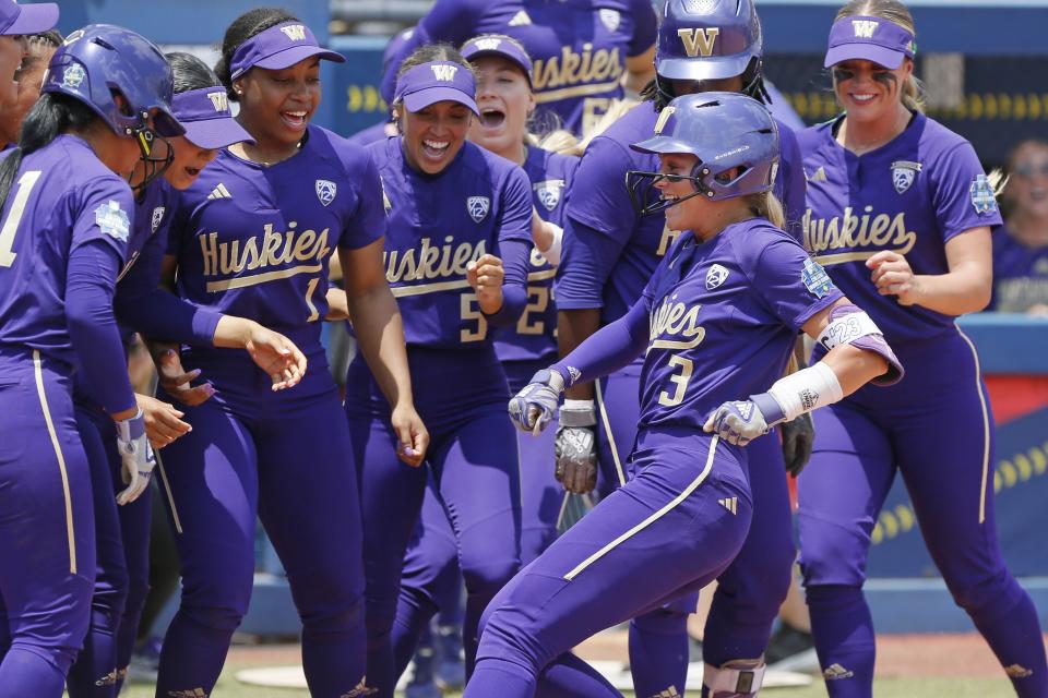 Washington celebrates a home run by Rylee Holtorf at the NCAA softball Women’s College World Series game against Utah Friday, June 2, 2023, in Oklahoma City. | Nate Billings, Associated Press