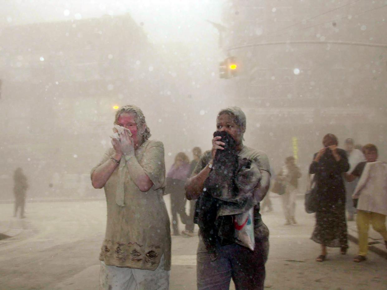 File photo of people covered in dust on September 11