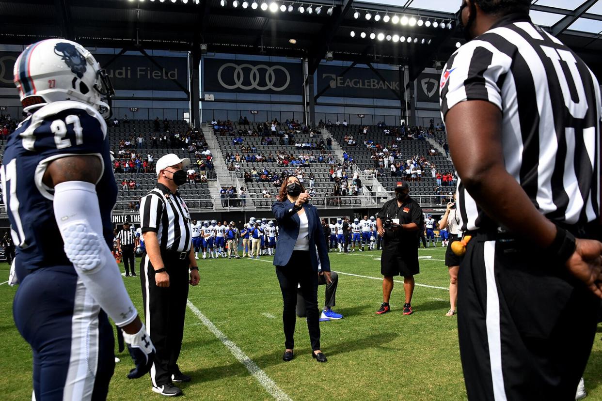 US Vice President Kamala Harris tosses the coin for the football game between Howard University and Hampton University at Audi Field in Washington, DC, on September 18, 2021.