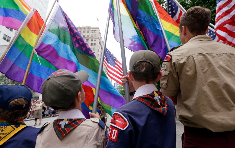 Cub Scouts and Boy Scouts prepare to lead marchers while waving rainbow-colored flags at the 41st annual Pride Parade in Seattle on June 28, 2015.<span class="copyright">Elaine Thompson—AP</span>
