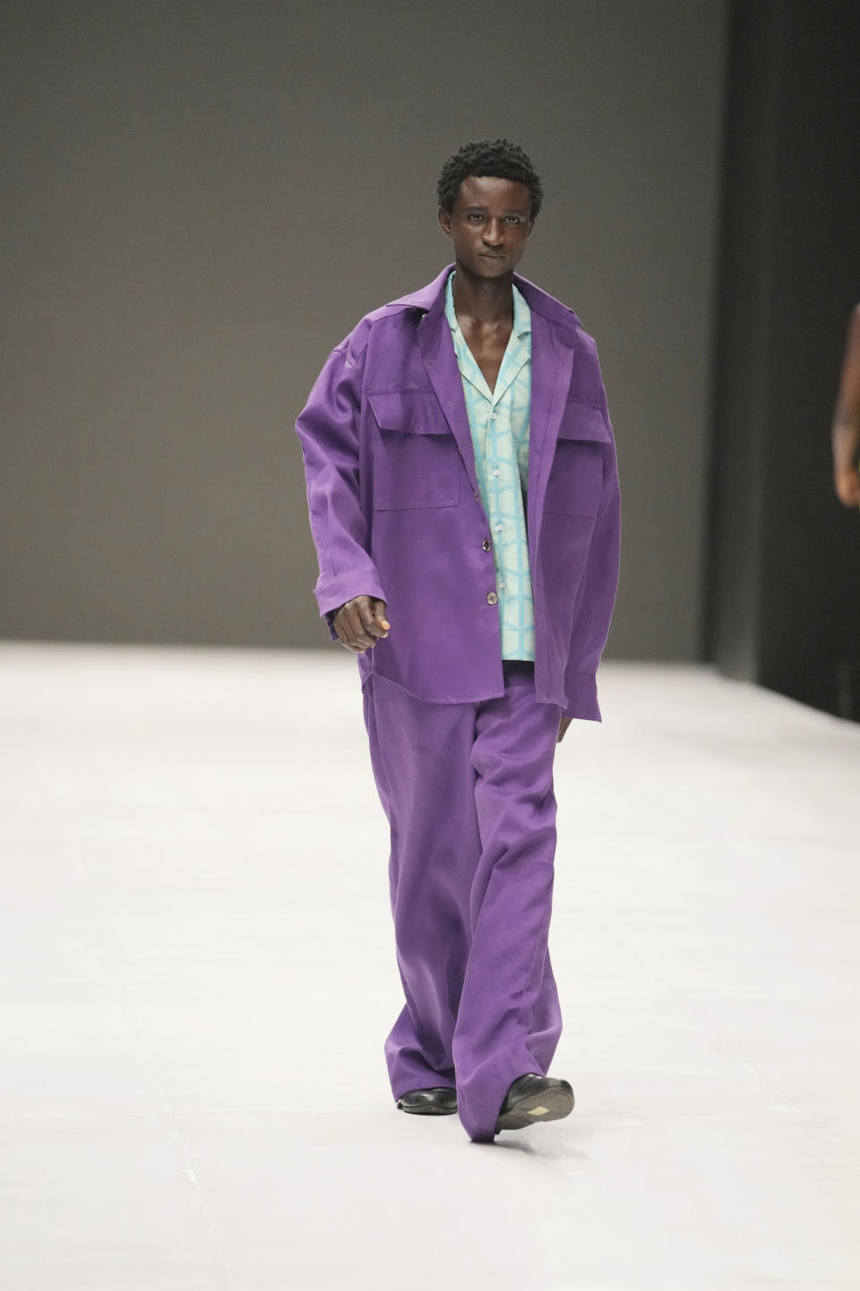 A model wears a creation by Kadiju during the Lagos Fashion Week in Lagos, Nigeria, Thursday, Oct. 26, 2023. Africa's fashion industry is rapidly growing to meet local and international demands but a lack of adequate investment still limits its full potential, UNESCO said Thursday in its new report released at this year's Lagos Fashion Week show. (AP Photo/Sunday Alamba)