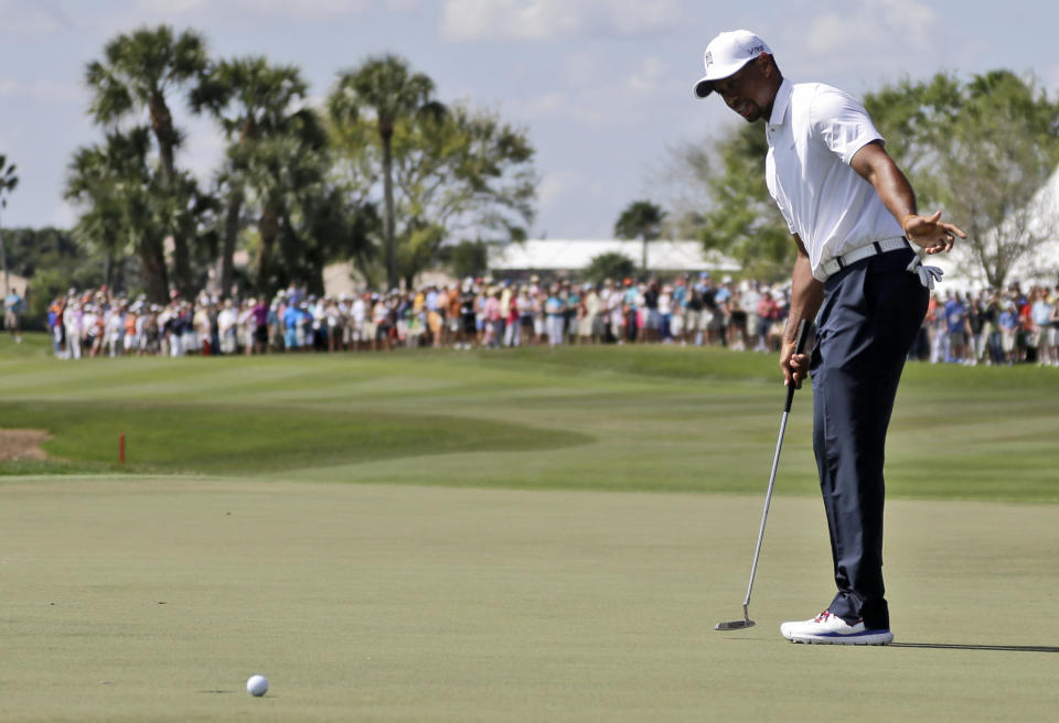 Tiger Woods reacts after his putt falls short on the 18th green during the third round of the Honda Classic golf tournament, Saturday, March 1, 2014, in Palm Beach Gardens, Fla. (AP Photo/Lynne Sladky)