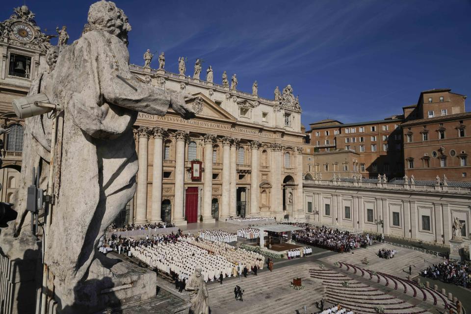 Pope Francis presides a mass concelebrated by the new cardinals for the start of the XVI General Assembly of the Synod of Bishops in St. Peter's Square at The Vatican, Wednesday, Oct.4, 2023. Pope Francis is convening a global gathering of bishops and laypeople to discuss the future of the Catholic Church, including some hot-button issues that have previously been considered off the table for discussion. Key agenda items include women's role in the church, welcoming LGBTQ+ Catholics, and how bishops exercise authority. For the first time, women and laypeople can vote on specific proposals alongside bishops (AP Photo/Andrew Medichini)