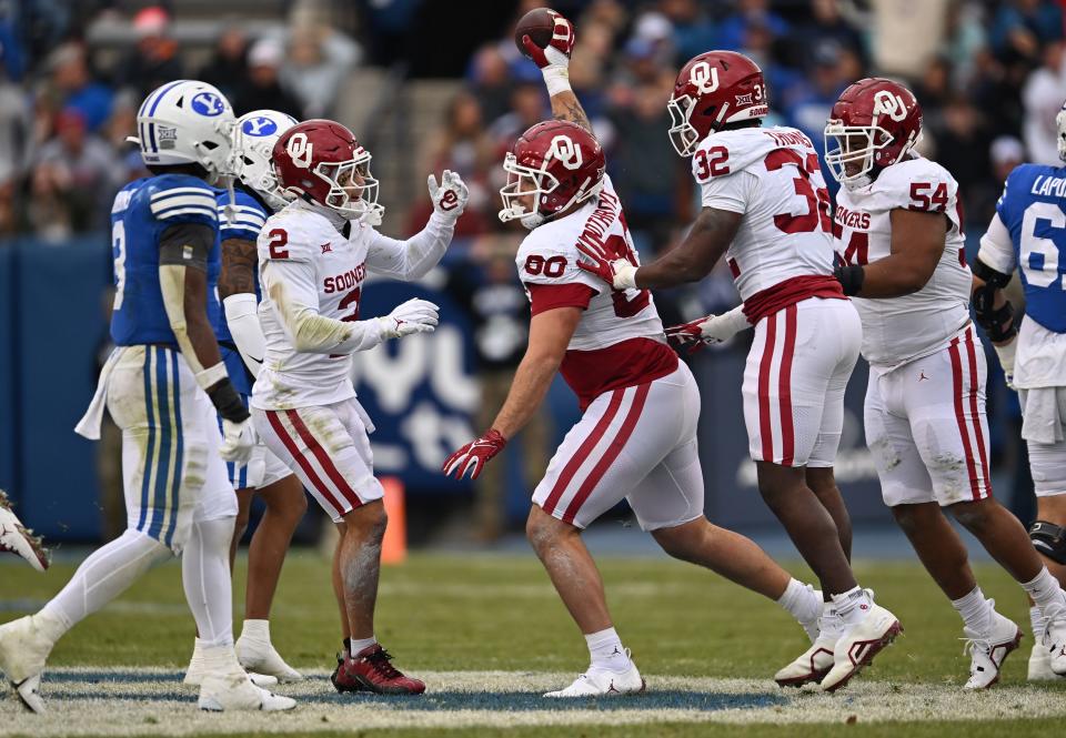 Oklahoma Sooners defensive lineman Rondell Bothroyd (80) comes up with a fumble as BYU and Oklahoma play at LaVell Edwards Stadium in Provo on Saturday, Nov. 18, 2023. | Scott G Winterton, Deseret News
