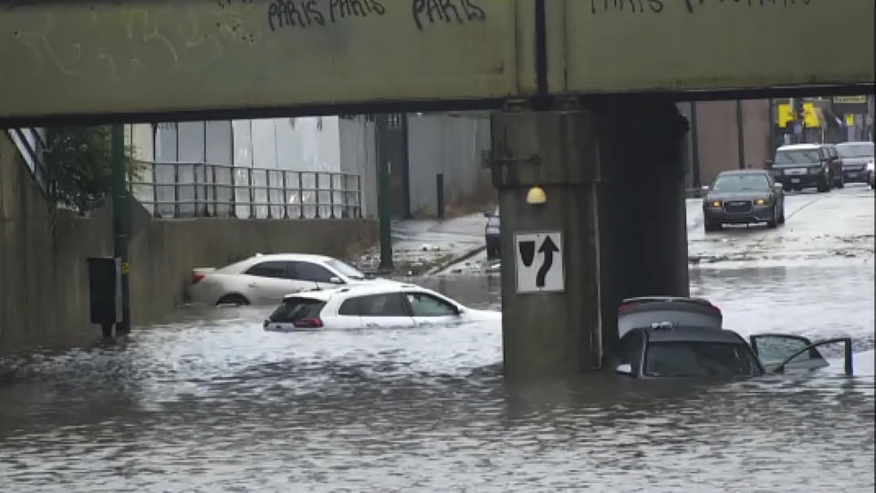 In this image taken from video provided by ABC7 Chicago, several vehicles are stranded in the flooded viaduct at Fifth and Cicero avenues, in Chicago, Sunday, July 2, 2023. (ABC7 Chicago via AP)