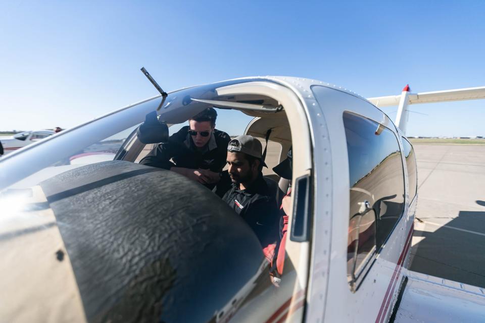 Oklahoma University student Alias John sits in a plane at an OU aviation and aerospace day at Max Westheimer Airport in Norman on Friday, April 8, 2022.