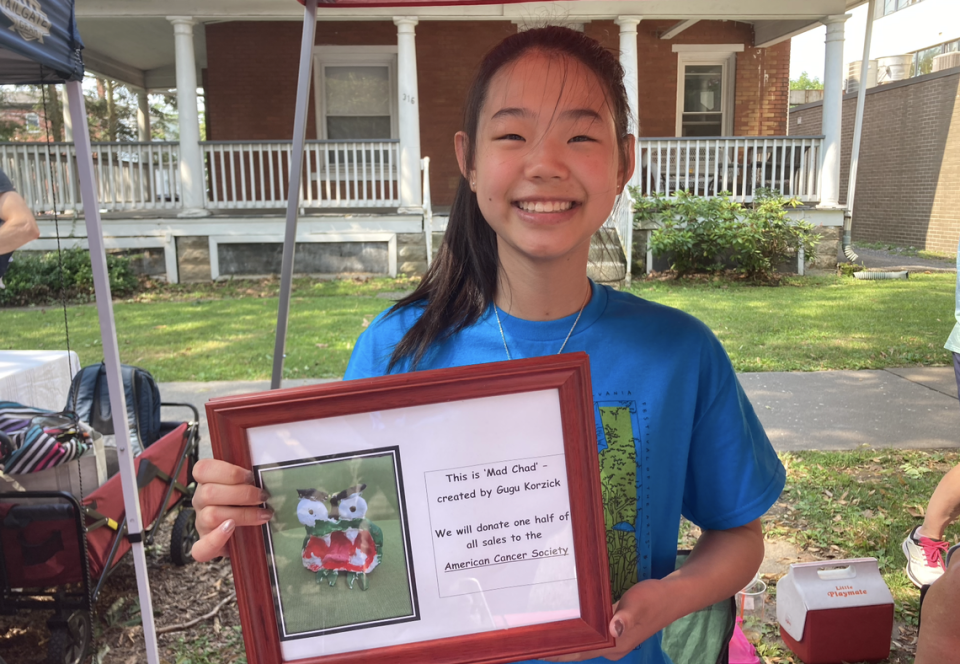 Giulia Hope Korzick shows off a photo of the original Mad Chad.