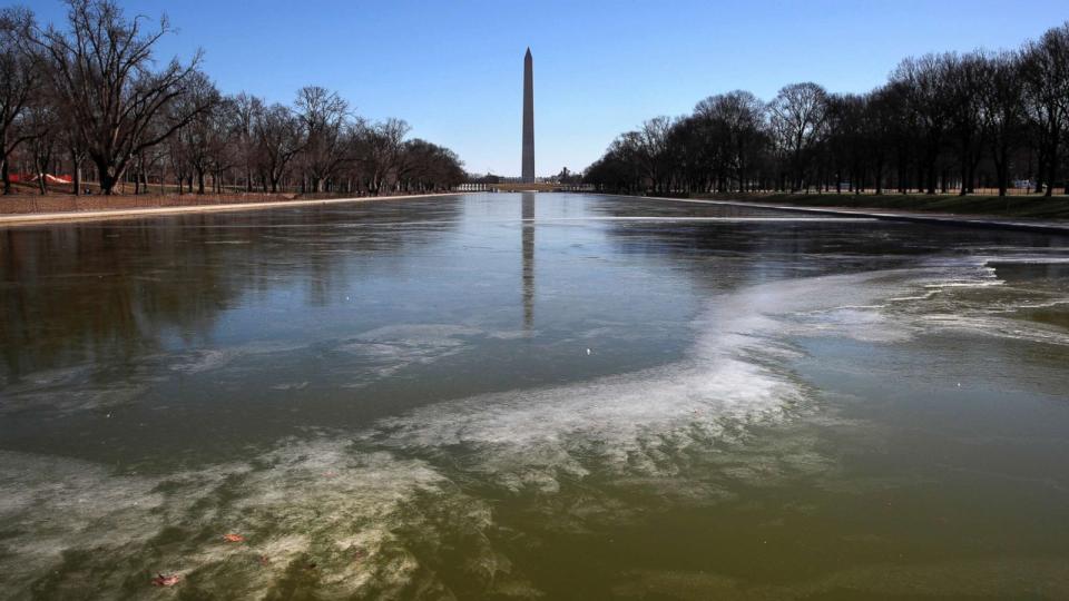 PHOTO: With the Washington Monument in the background, the reflecting pool by the Lincoln Memorial begins to turn to ice during frigid temperatures on the National Mall, Jan. 21, 2019, in Washington D.C. (Jacquelyn Martin/AP)