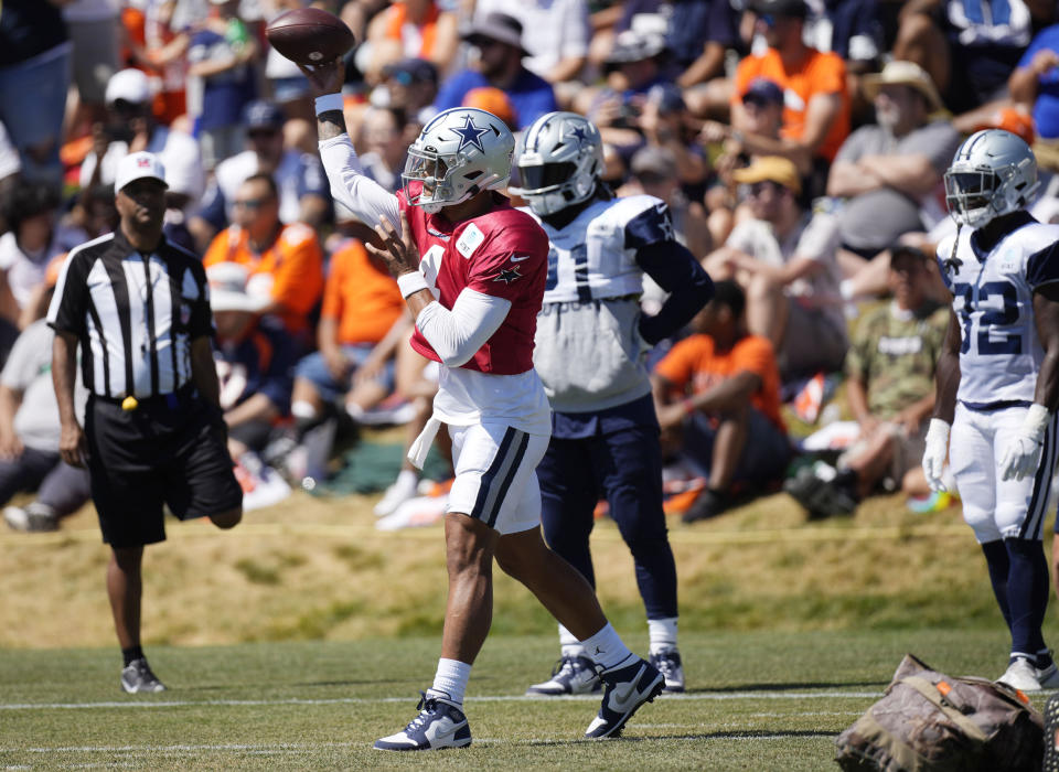 Dallas Cowboys quarterback Dak Prescott throwa a pass during an NFL football practice Thursday, Aug. 11, 2022, at the Denver Broncos' headquarters in Centennial, Colo. (AP Photo/David Zalubowski)