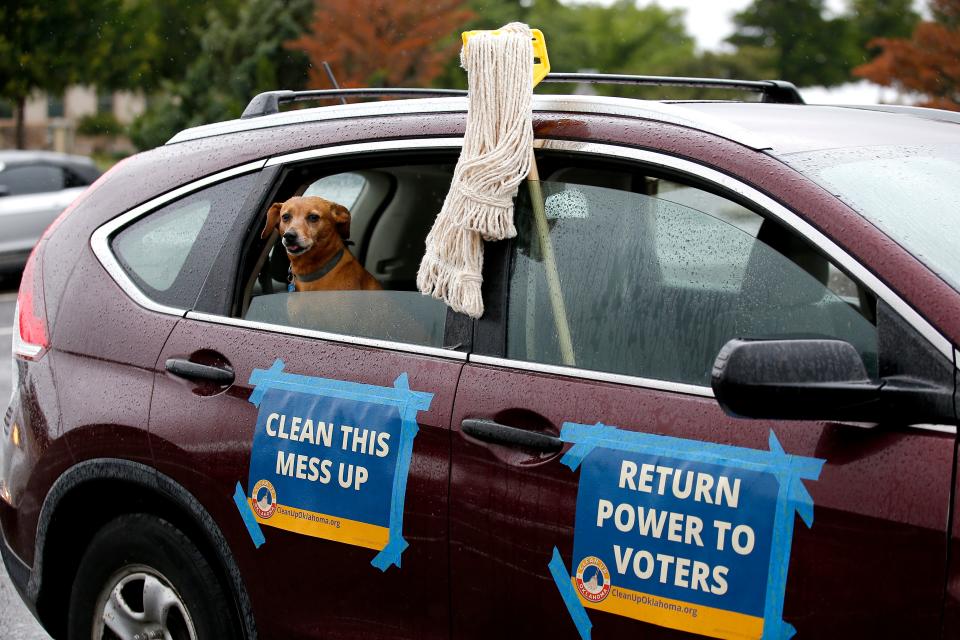 Ginger waits for the caravan to start during a rally by Clean-Up Oklahoma during an at the state Capitol in Oklahoma City, Wednesday, May, 25, 2022. 