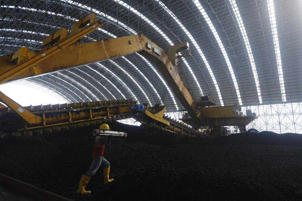 Coal is being stored for the Maitree Super Thermal Power Project near the Sundarbans, the world’s largest mangrove forest, in Rampal, Bangladesh, Monday, Oct. 17, 2022. A power plant will start burning coal as part of Bangladesh’s plan to meet its energy needs and improve living standards, officials say. (AP Photo/Al-emrun Garjon)