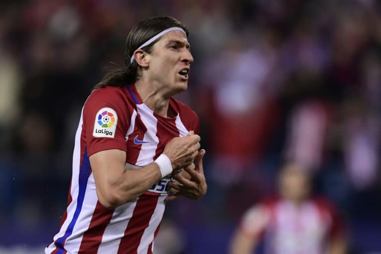 Atletico Madrid's defender Filipe Luis celebrates after scoring during the Spanish league football match Club Atletico de Madrid vs Real Sociedad at the Vicente Calderon stadium in Madrid on April 4, 2017