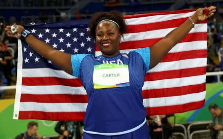 2016 Rio Olympics - Athletics - Final - Women's Shot Put Final - Olympic Stadium - Rio de Janeiro, Brazil - 12/08/2016. Michelle Carter (USA) of USA celebrates after winning the gold medal in the women's shot put. REUTERS/Kai Pfaffenbach