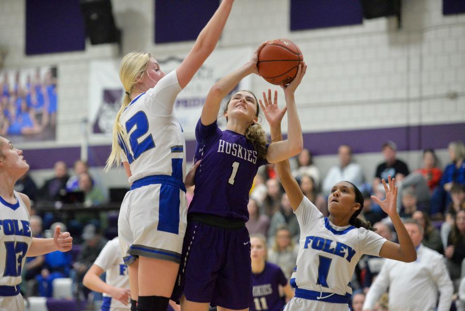 Albany's Alyssa Sand goes up for a shot in the paint against Foley at Albany High School on Friday, Jan. 28, 2022. 