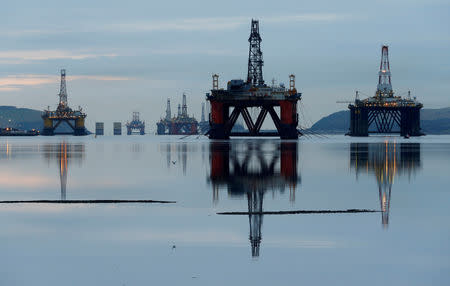 FILE PHOTO: Drilling rigs are parked up in the Cromarty Firth near Invergordon, Scotland, Britain January 27, 2015. REUTERS/Russell Cheyne/File Photo