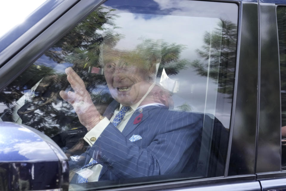 Britain's King Charles III waves to members of the public after touring City Shamba, an urban farming project at Mama Lucy Hospital in Nairobi, Tuesday, Oct. 31, 2023. King Charles is in Kenya for a four-day trip, his first state visit to a Commonwealth country as monarch, underscoring his commitment to an organization that's been central to Britain's global power and prestige since World War II. (AP Photo/Brian Inganga, Pool)