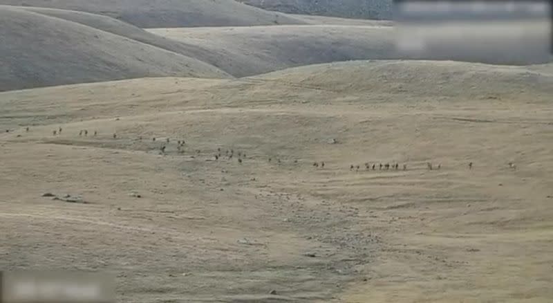 A still image shows said to be Azerbaijani soldiers at an unidentified location