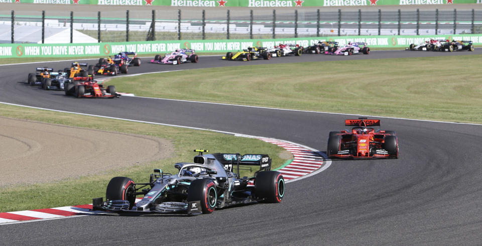 Mercedes driver Valtteri Bottas of Finland leads Ferrari driver Sebastian Vettel of Germany at the start of the Japanese Formula One Grand Prix at Suzuka Circuit in Suzuka, central Japan, Sunday, Oct. 13, 2019. (AP Photo/Toru Takahashi)