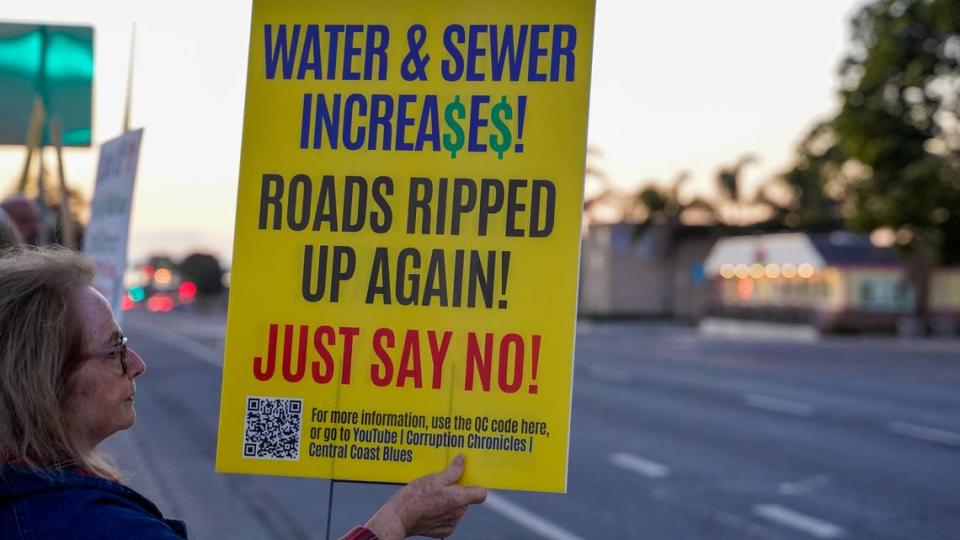 Grover Beach residents protest a proposed 91.7% water rate increase over the next five years, before the Grover Beach City Council meeting on Nov. 13, 2023. Some residents said they have started knocking on doors, encouraging their neighbors to write letters of protest against the project.