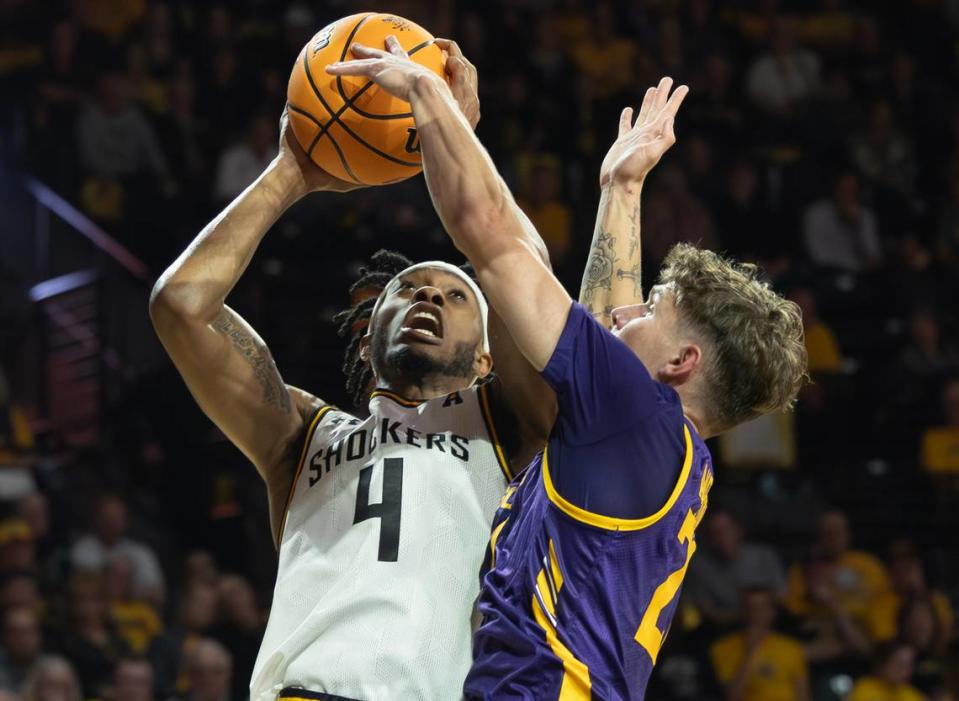 Wichita State’s Colby Rogers drives to the basket against Lipscomb’s Joe Anderson during the first half of their season opener on Monday night at Koch Arena. Rogers poured in 18 points in the first half in his first official game as a Shocker. Travis Heying/The Wichita Eagle