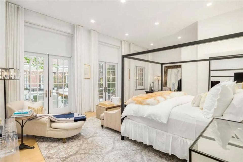 The main bedroom in the posh penthouse. Brown Harris Stevens