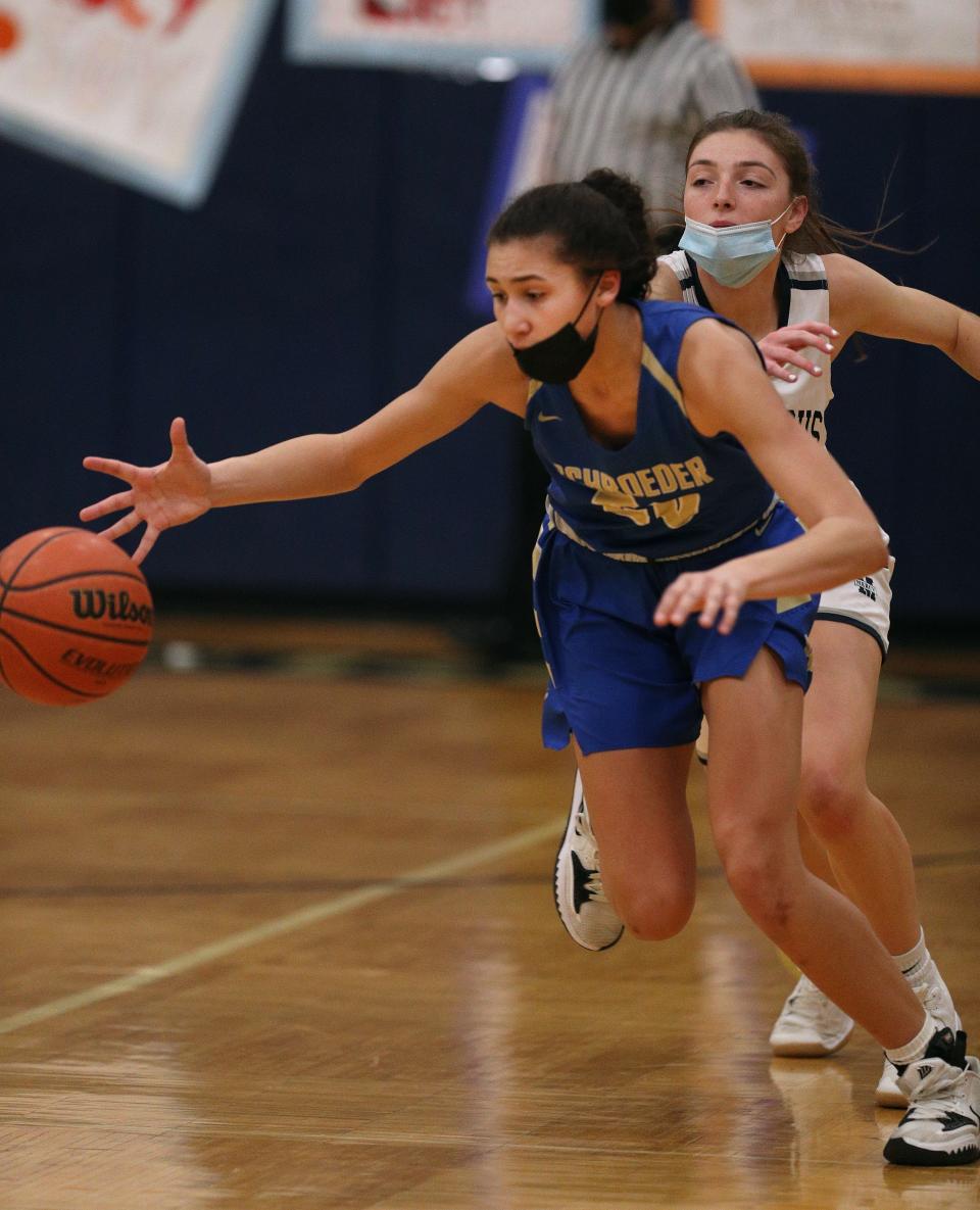 Schroeder guard Mariah Watkins steals the ball from Mercys Sophie Dearcop. 