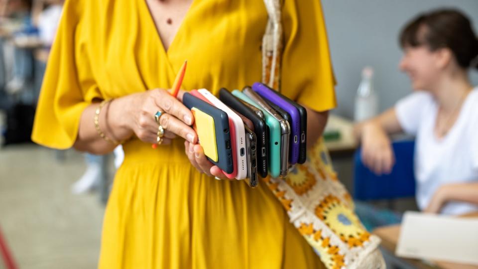 <div>A teacher holds the mobile phones of her students before a test.</div> <strong>(Matteo Rossetti/Mondadori Portfolio via Getty Images)</strong>