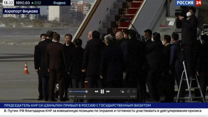 In this grab taken from video provided by RU-24, China's President Xi Jinping disembarks his plane, upon his arrival at the Vnukovo-2 government airport outside Moscow, Monday, March 20, 2023. (RU- 24 via AP)