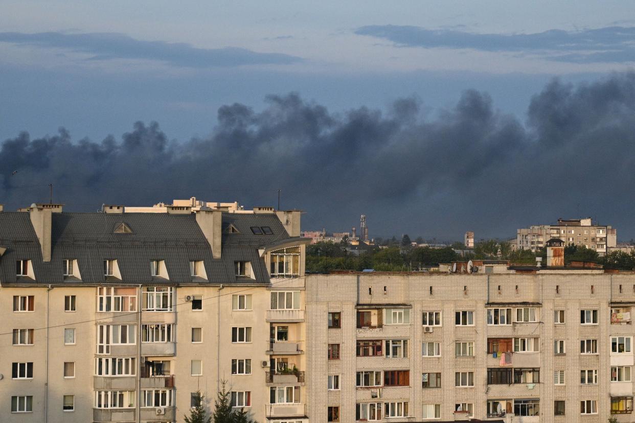 Black smoke billows over the city after drone strikes in the western Ukrainian city of Lviv (AFP via Getty Images)