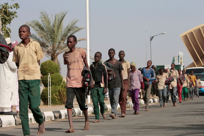 Freed Nigerian schoolboys walk after they were rescued by security forces in Katsina