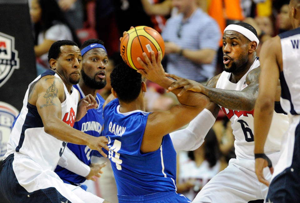 (L-R) Andre Iguodala #9 of the US Men's Senior National Team, Francisco Garcia #9 and Edgar Sosa #4 of the Dominican Republic and LeBron James #6 of the US Men's Senior National Team battle for the ball during a pre-Olympic exhibition game at Thomas & Mack Center on July 12, 2012 in Las Vegas, Nevada. (David Becker/Getty Images)