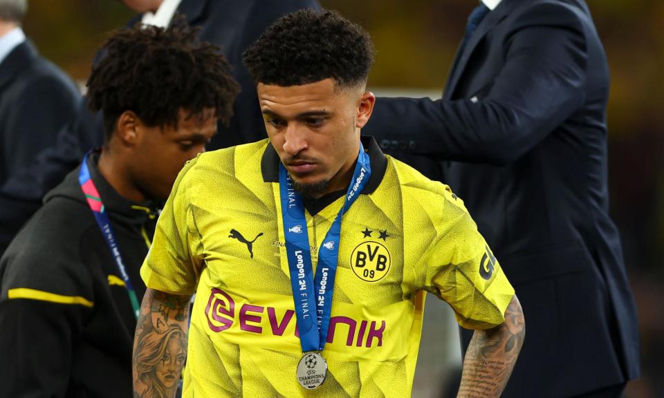 <span><a class="link " href="https://sports.yahoo.com/soccer/players/1265001/" data-i13n="sec:content-canvas;subsec:anchor_text;elm:context_link" data-ylk="slk:Jadon Sancho;sec:content-canvas;subsec:anchor_text;elm:context_link;itc:0">Jadon Sancho</a> cuts a dejected figure as he collects his Champions League runners-up medal.</span><span>Photograph: Kieran McManus/Shutterstock</span>