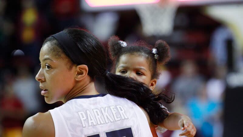United States' Candace Parker holds her daughter Lailaa, 3, after the team beat China in an exhibition women's basketball game Saturday, May 12, 2012, in Seattle.