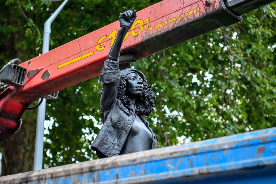 The statue was removed from the plinth and loaded into a recycling and skip hire lorry on Thursday morning (PA)