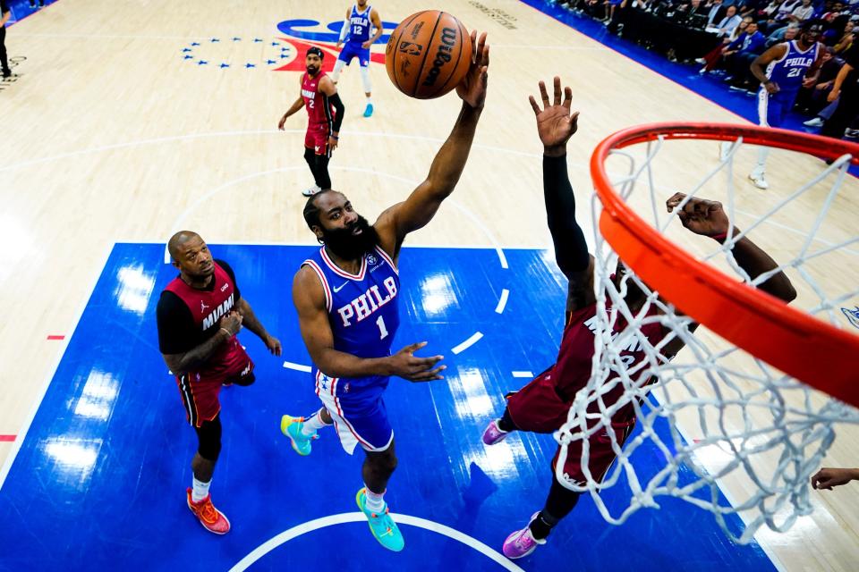 The Sixers' James Harden goes up for a shot in front of the Heat's P.J. Tucker in Game 6 of the teams' playoff series.