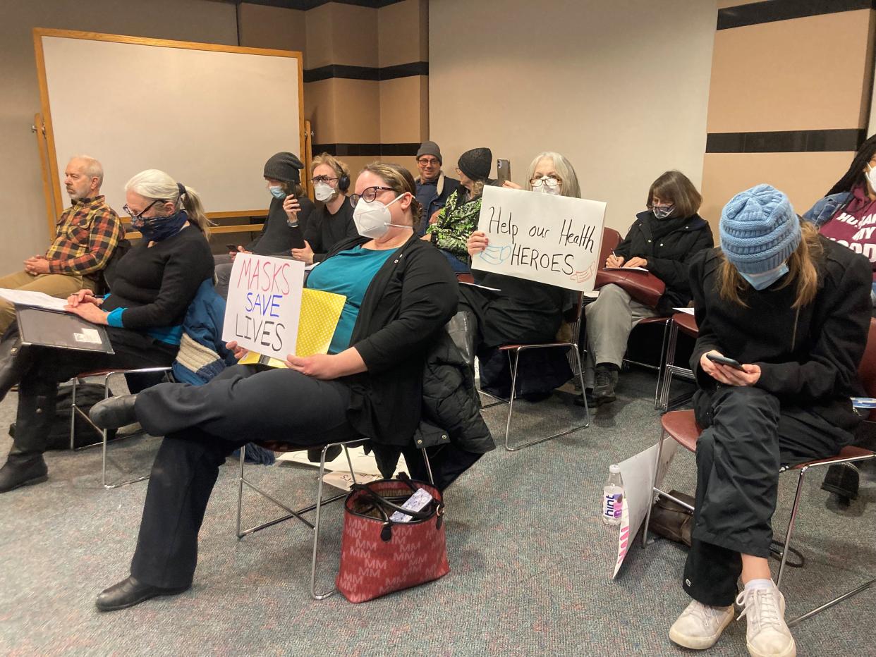 Residents show their support for a mask mandate at a St. Cloud City Council meeting Monday, Jan. 24, 2022 at the Stearns County Courthouse.