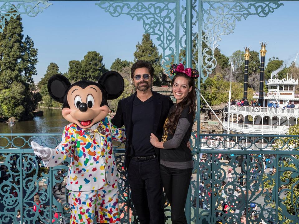 John Stamos and Caitlin McHugh Stamos at Disneyland.