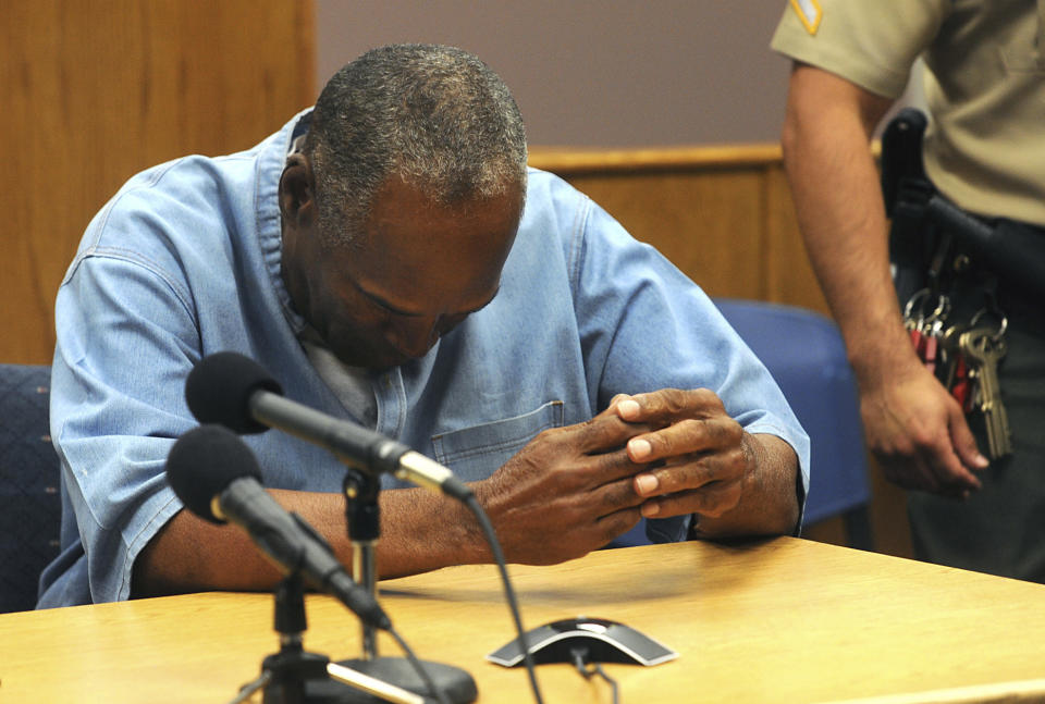 <p>Former NFL football star O.J. Simpson reacts after learning he was granted parole at Lovelock Correctional Center in Lovelock, Nev., on Thursday, July 20, 2017. Simpson was convicted in 2008 of enlisting some men he barely knew, including two who had guns, to retrieve from two sports collectibles sellers some items that Simpson said were stolen from him a decade earlier. (Jason Bean/The Reno Gazette-Journal via AP, Pool) </p>