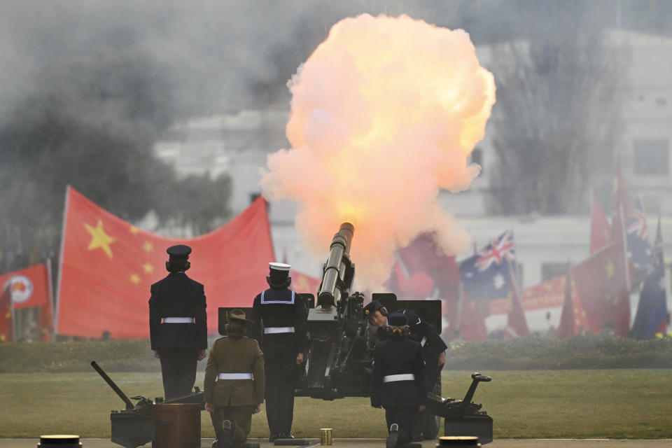 A gun salute as Chinese Premier Li Qiang inspects a guard of honor outside Parliament House in Canberra, Monday, June 17, 2024. Li, Australian Prime Minister Anthony Albanese and senior ministers of both administrations met at Parliament House on Monday to discuss thorny issues, including lingering trade barriers, conflict between their militaries in international waters and China's desire to invest in critical minerals. (Lukas Coch/Pool Photo via AP)