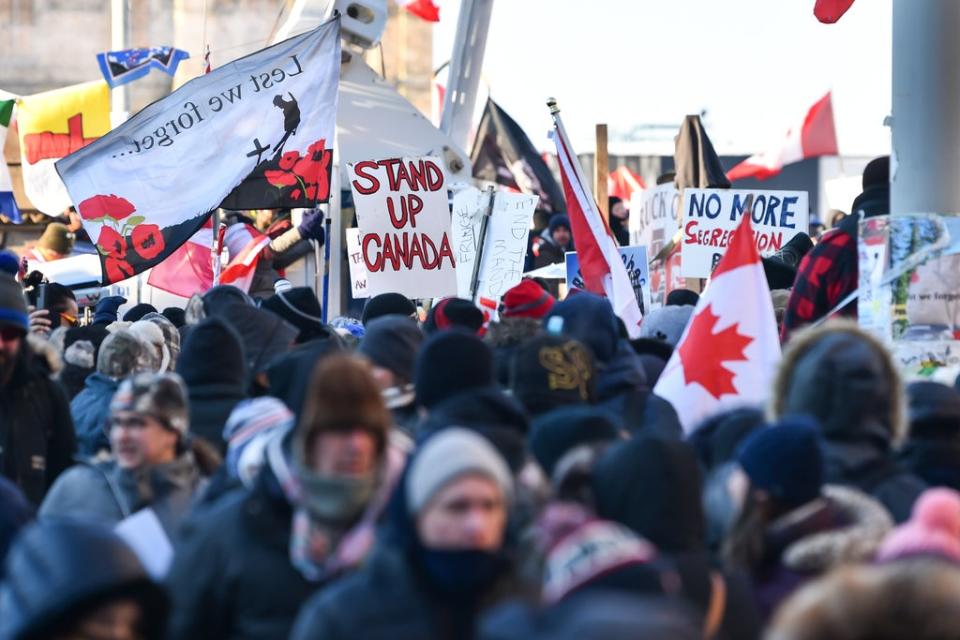 Thousands of protesters gathered near Parliament Hill in Ottawa on Saturday holding signs condemning the vaccine mandates (Getty Images)
