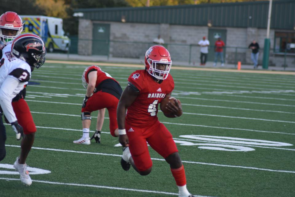 Savannah Christian running back Zo Smalls tries to beat Hephzibah defensive back Deshaun Lewis to the corner during Saturday night's game. 