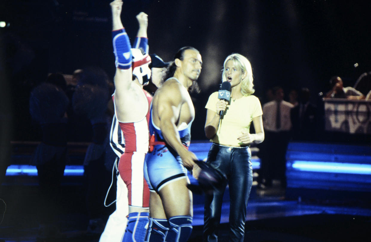 BIRMINGHAM, ENGLAND:  Wolf (Michael van Wijk) and host Ulrika Jonsson during the filming of Gladiators for Comic Relief at the National Indoor Arena in Birmingham, which was shown during the Red Nose Day telethon on March 14, 1997. The event raised over £27m for charitable causes. (Photo by George Bodnar/Comic Relief via Getty Images) (Photo by Comic Relief/Comic Relief via Getty Images)