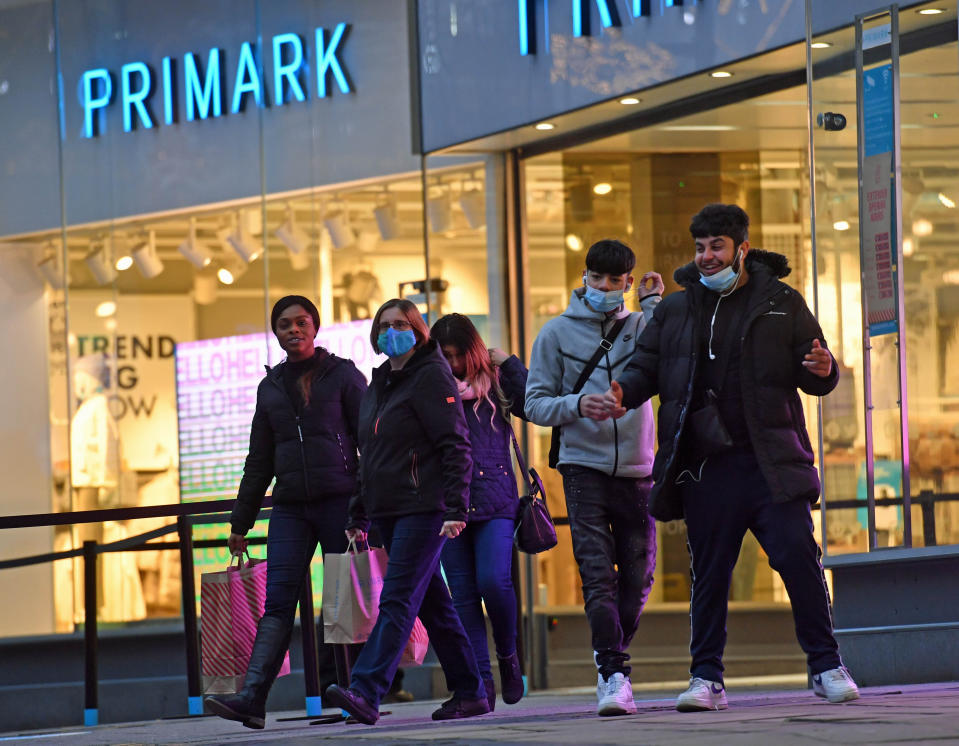 Shoppers leaving Primark in Birmingham as non-essential shops in England open their doors to customers for the first time after the second national lockdown ends and England has a strengthened tiered system of regional coronavirus restrictions.