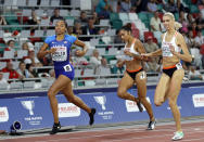 FILE - In this Sept. 9, 2019, file photo, Allyson Felix of the U.S, left, competes during a women's 400-meter run in the Match Europe against USA at Dinamo stadium in Minsk, Belarus. A rebellion led by some of track and field's top athletes, like Felix, had led to changes in sponsorship contracts that are altering what could best be described as the sport's 'pregnancy penalty.' For decades, the message to women in track and field was crystal clear: get pregnant, lose sponsorship money. (AP Photo/Sergei Grits, File)