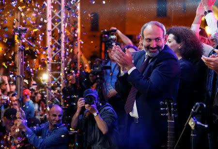 Armenian opposition leader Nikol Pashinyan applauds at a rally after his bid to be interim prime minister was blocked by the parliament in Yerevan, Armenia May 1, 2018. REUTERS/Gleb Garanich