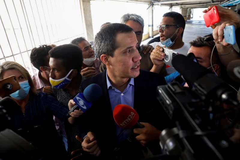 Venezuela's opposition leader Juan Guaido speaks to the media, in Caracas