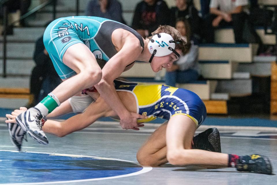 Sultana's Rocky Humphrey, left, battles against Henry Aslikyan during their 106-pound championship match at the 15th annual Adrian Amaral Scholarship Invitational on Saturday, Jan. 7, 2023.