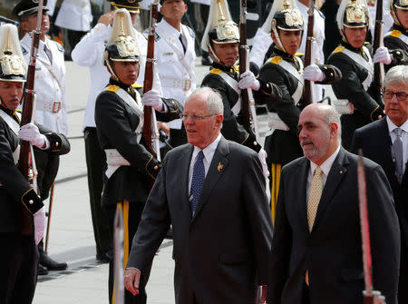 Peru's President Pedro Pablo Kuczynski (L) arrives for the inauguration of President-elect Lenin Moreno (not pictured) at the National Assembly in Quito, Ecuador May 24, 2017. REUTERS/Henry Romero